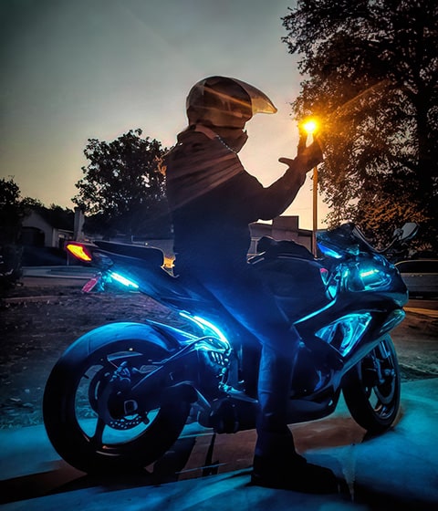 Sport Bike Owner Riding with Underglow Lighting On